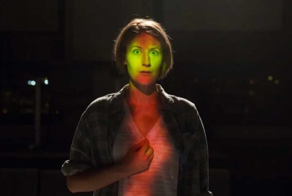 actor with green light on face