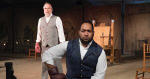 George Westinghouse—played by Billy Mason, front and center—ponders his next move in ‘The Current War’ while Thomas Edison (Daniel Krell) hovers menacingly.