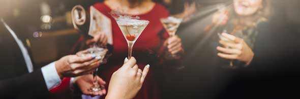 Hands holding cocktails